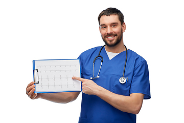 Image showing smiling male doctor with cardiogram on clipboard