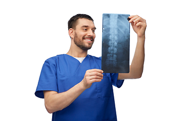 Image showing happy smiling doctor or male nurse with x-ray