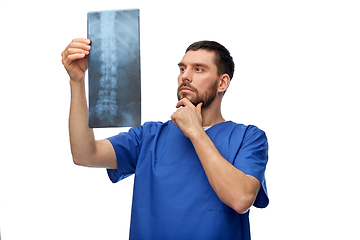 Image showing doctor or male nurse looking at x-ray scan