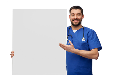 Image showing smiling male doctor or nurse with big white board