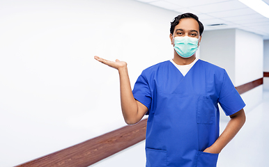 Image showing indian male doctor in blue uniform and mask