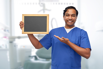 Image showing indian male doctor or dentist with chalkboard