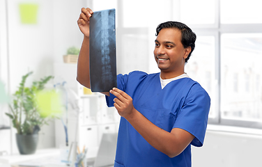 Image showing happy indian doctor or male nurse with x-ray