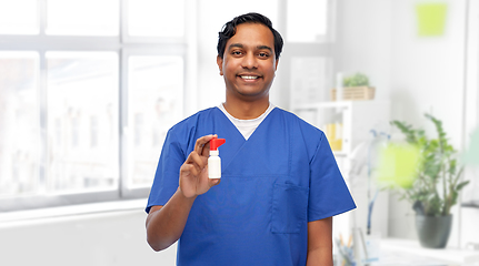 Image showing smiling indian male doctor or nurse with medicine