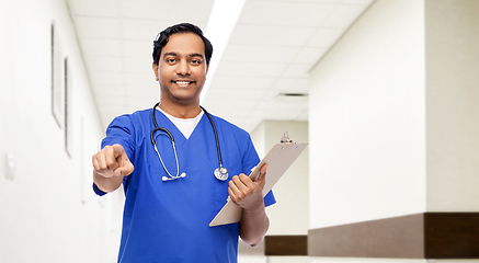 Image showing indian doctor or male nurse pointing to camera