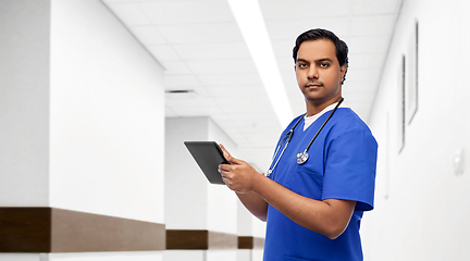 Image showing indian doctor or male nurse using tablet computer