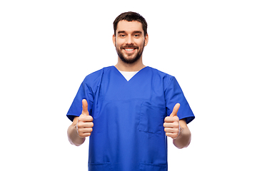 Image showing happy smiling male doctor showing thumbs up