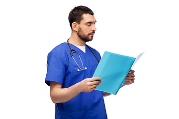 Image showing male doctor reading medical report in folder