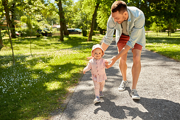 Image showing happy father with baby daughter walking at park