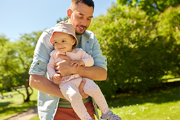 Image showing happy father with baby daughter at summer park