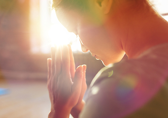 Image showing close up of woman meditating at yoga studio