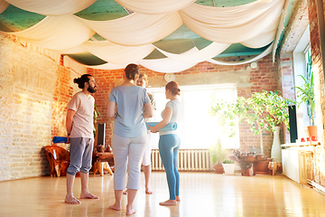 Image showing group of people with mats at yoga studio or gym