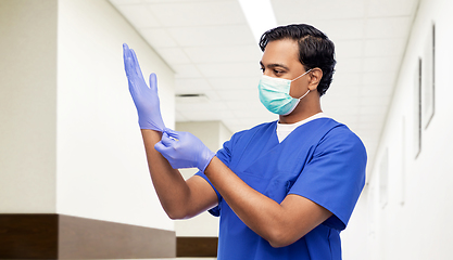 Image showing indian male doctor in uniform, mask and gloves