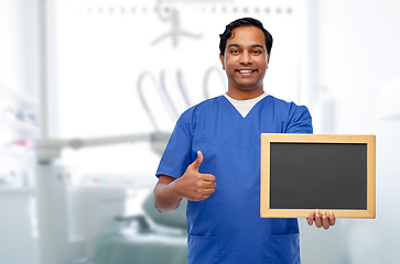 Image showing indian male doctor or dentist with chalkboard