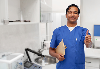 Image showing smiling doctor or male nurse showing thumbs up
