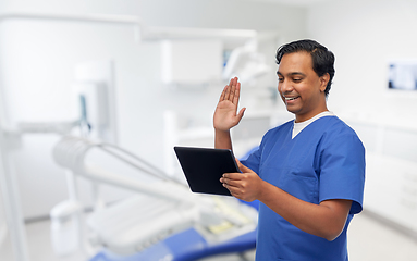 Image showing doctor or male dentist has video call on tablet pc