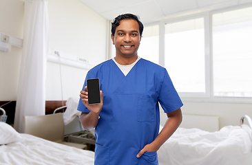 Image showing happy doctor or male nurse with phone at hospital