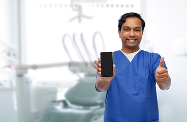 Image showing doctor or dentist with phone showing thumbs up