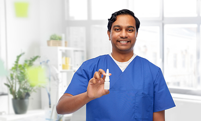 Image showing smiling indian male doctor or nurse with medicine