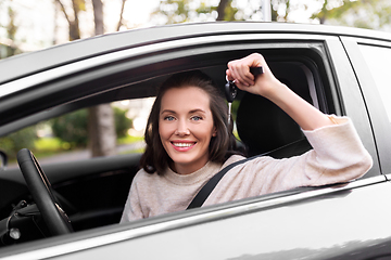 Image showing woman or female driver with car key in city