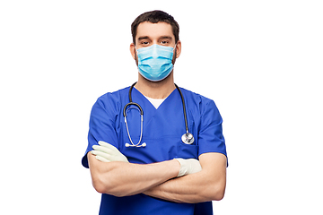 Image showing male doctor in blue uniform, mask and gloves