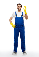 Image showing happy male worker or cleaner showing ok hand sign