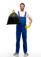 Image showing happy male worker or cleaner with garbage bag