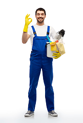 Image showing male cleaner with cleaning supplies showing ok
