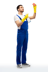 Image showing male cleaner cleaning with sponge and detergent