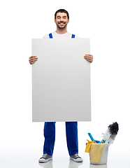 Image showing male cleaner with cleaning stuff and white board