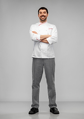 Image showing happy smiling male chef in jacket