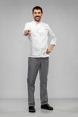 Image showing happy smiling male chef in jacket