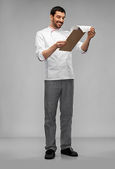 Image showing happy smiling male chef with clipboard