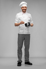 Image showing happy smiling male chef with saucepan cooking food