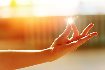 Image showing hand of meditating yogi woman showing gyan mudra