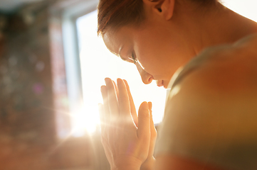 Image showing close up of woman meditating at yoga studio