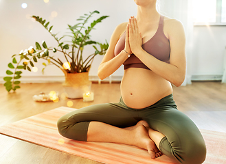 Image showing pregnant woman doing yoga at home