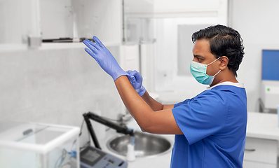 Image showing indian male doctor in uniform, mask and gloves