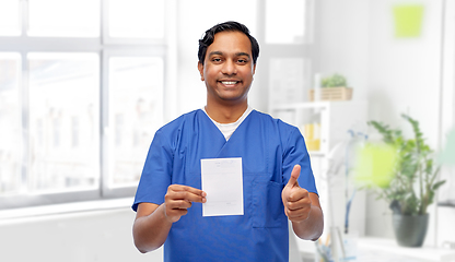 Image showing indian doctor with prescription showing thumbs up