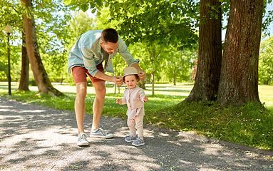 Image showing happy father with baby daughter at summer park