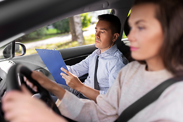 Image showing car driving school instructor and young driver