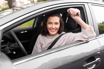 Image showing woman or female driver with car key in city