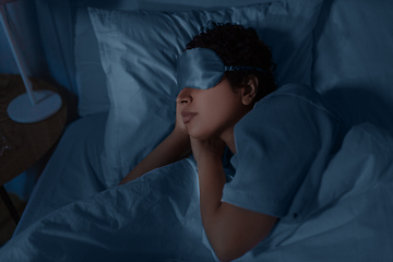 Image showing african woman sleeping in bed at home at night