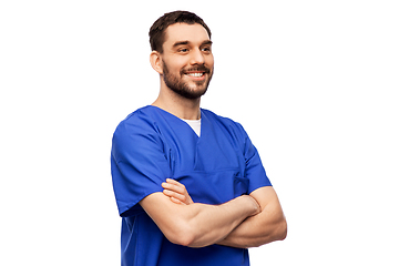 Image showing happy smiling doctor or male nurse in blue uniform