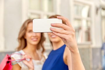 Image showing happy women taking selfie with smartphone