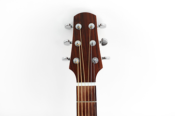 Image showing close up of acoustic guitar head with pegs