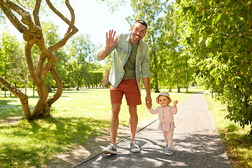 Image showing happy father with baby daughter walking at park
