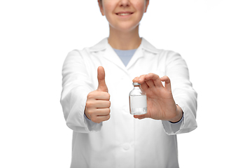 Image showing close up of doctor with medicine showing thumbs up