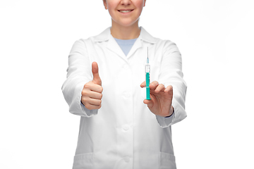 Image showing close up of doctor with syringe showing thumbs up