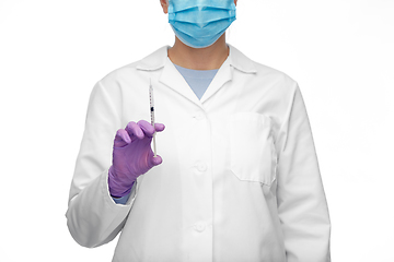 Image showing close up of doctor with syringe